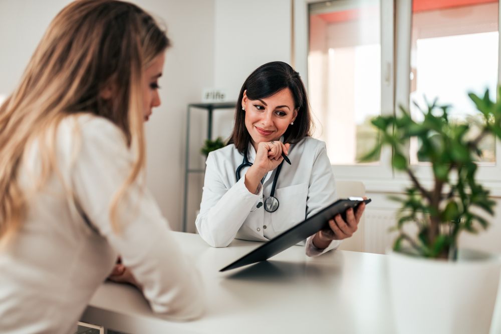 Smiling doctor consulting her patient