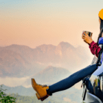 woman traveler sitting and overlooking mountains