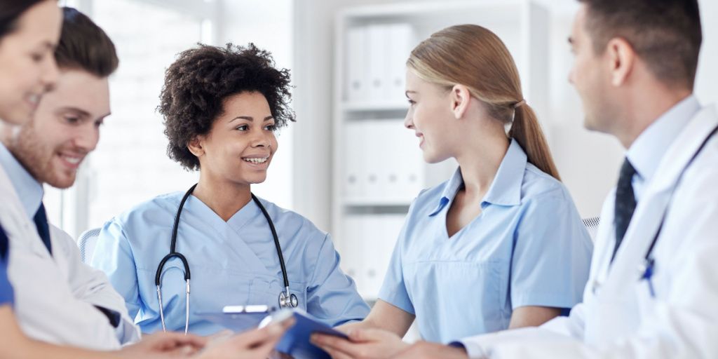 Two female nurses talking to each other
